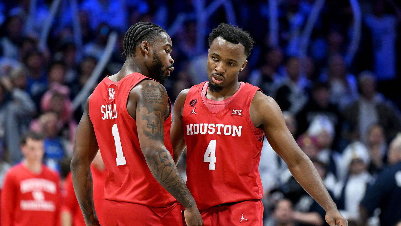 CINCINNATI, OHIO - DECEMBER 01: LJ Cryer #4 of the Houston Cougars celebrates with Jamal Shead #1 during the game against the Xavier Musketeers at Cintas Center on December 01, 2023 in Cincinnati, Ohio.