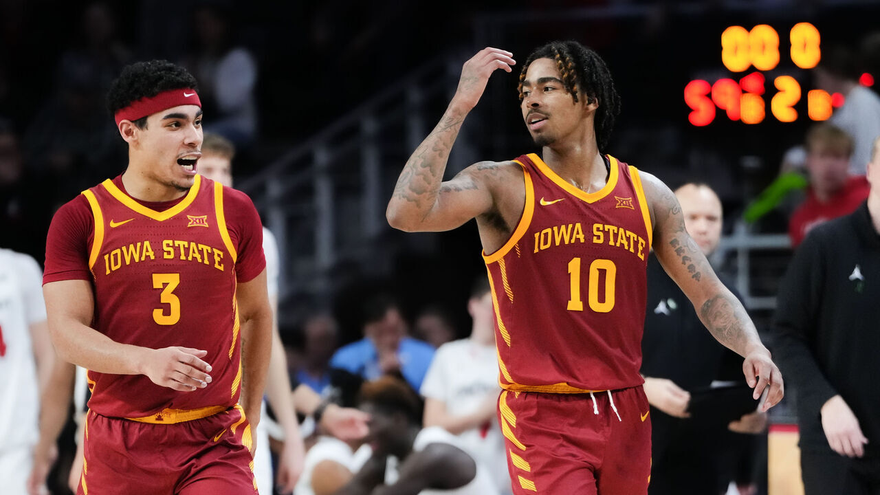 CINCINNATI, OHIO - FEBRUARY 13: Tamin Lipsey #3 and Keshon Gilbert #10 of the Iowa State Cyclones celebrate after beating the Cincinnati Bearcats 68-59 at Fifth Third Arena on February 13, 2024 in Cincinnati, Ohio.