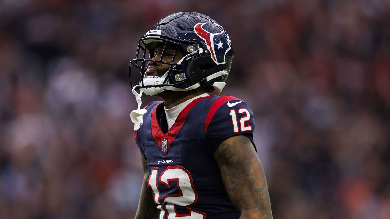 HOUSTON, TEXAS - JANUARY 13: Nico Collins #12 of the Houston Texans celebrates after a catch during an AFC wild-card playoff football game against the Cleveland Browns at NRG Stadium on January 13, 2024 in Houston, Texas.