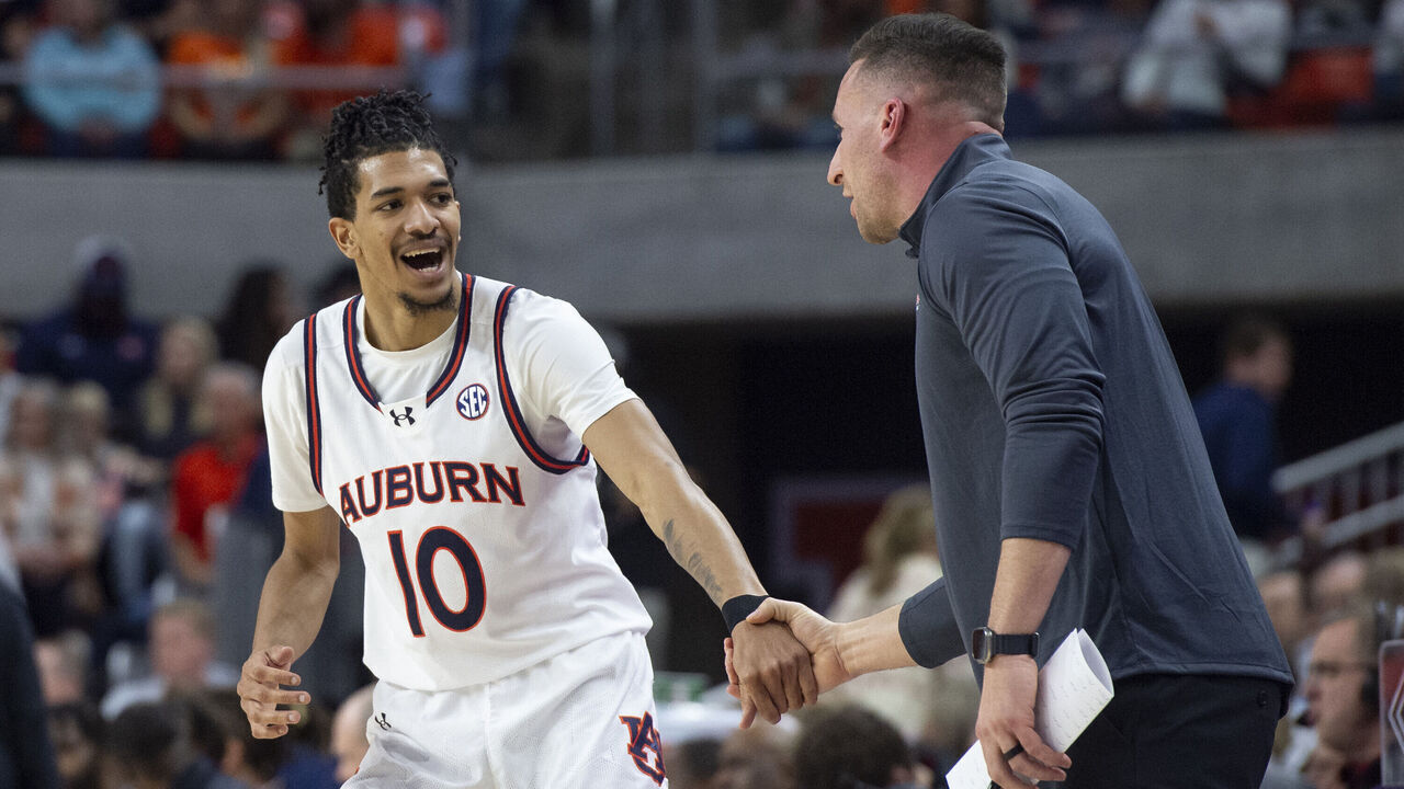 AUBURN, ALABAMA - FEBRUARY 14: Chad Baker-Mazara #10 of the Auburn Tigers talks with associate head coach Steven Pearl of the Auburn Tigers during their game against the South Carolina Gamecocks at Neville Arena on February 14, 2024 in Auburn, Alabama.
