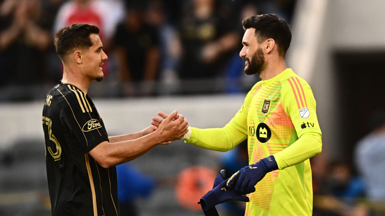 Los Angeles FC goalkeeper #1 Hugo Lloris and Los Angeles FC defender #33 Aaron Long celebrate after winning the MLS football match between the Los Angeles FC and Seattle Sounders at BMO Stadium in Los Angeles, California on February 24, 2024. French World Cup winner Hugo Lloris made his debut for LAFC on Saturday as they beat the Seattle Sounders 2-1 in a re-match of last year's Western Conference semi-finals.