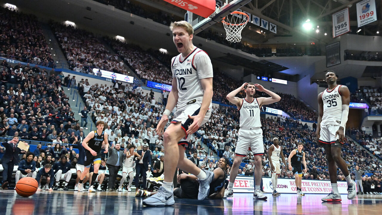 HARTFORD, CT - FEBRUARY 17: UConn Huskies guard Cam Spencer (12) and UConn Huskies forward Alex Karaban (11) react to the play during the game as the Marquette Golden Eagles take on the UConn Huskies on February 17, 2024 at the XL Center in Hartford, CT