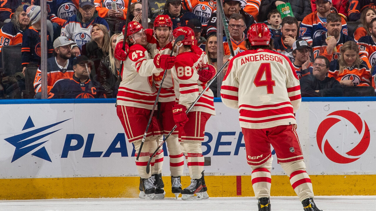 EDMONTON, CANADA - FEBRUARY 24: Noah Hanifin #55 of the Calgary Flames celebrates his second goal of the game in the second-period against the Edmonton Oilers with teammates Connor Zary #47, Andrew Mangiapane #88 and Rasmus Andersson #4 at Rogers Place on February 24, 2024, in Edmonton, Alberta, Canada.