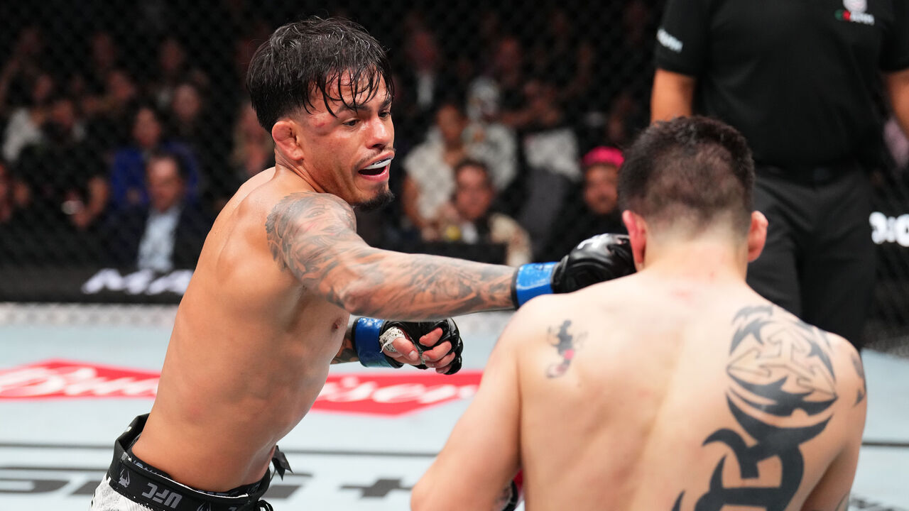 MEXICO CITY, MEXICO - FEBRUARY 24: (L-R) Brandon Royval punches Brandon Moreno of Mexico in a flyweight fight during the UFC Fight Night event at Arena CDMX on February 24, 2024 in Mexico City, Mexico.