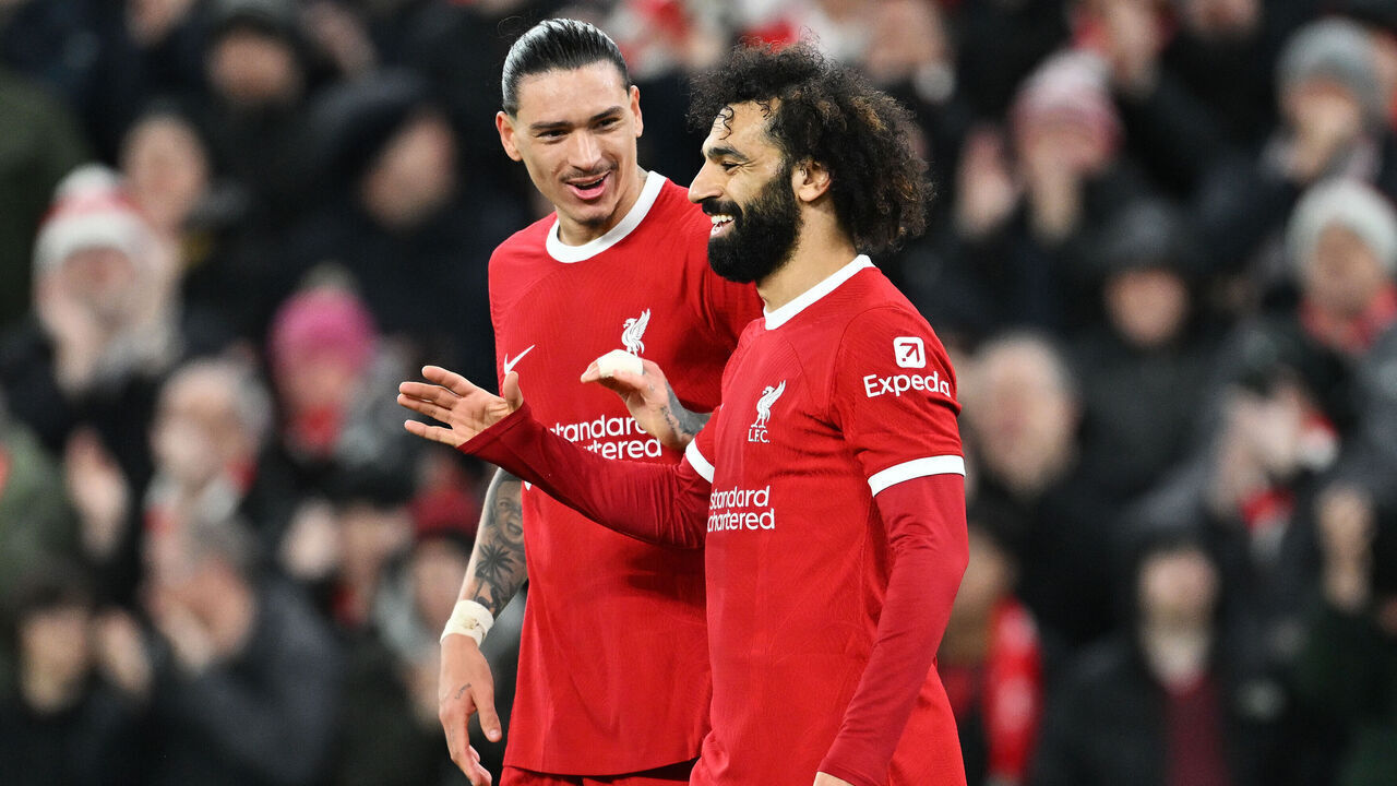 LIVERPOOL, ENGLAND - DECEMBER 20: Mohamed Salah of Liverpool celebrates with teammate Darwin Nunez after scoring their team's fourth goal during the Carabao Cup Quarter Final match between Liverpool and West Ham United at Anfield on December 20, 2023 in Liverpool, England.