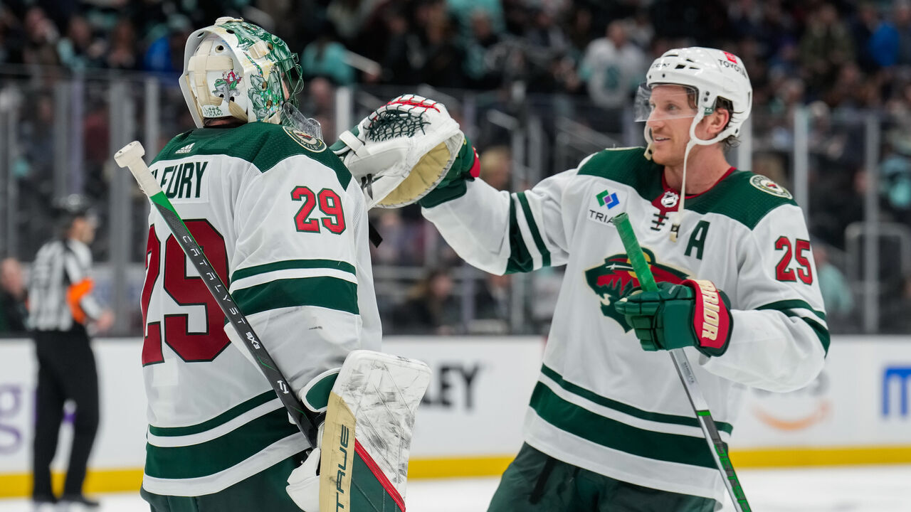 SEATTLE, WASHINGTON - FEBRUARY 24: Jonas Brodin #25 congratulates teammate Marc-Andre Fleury #29 of the Minnesota Wild after a game against the Seattle Kraken at Climate Pledge Arena on February 24, 2024 in Seattle, Washington.