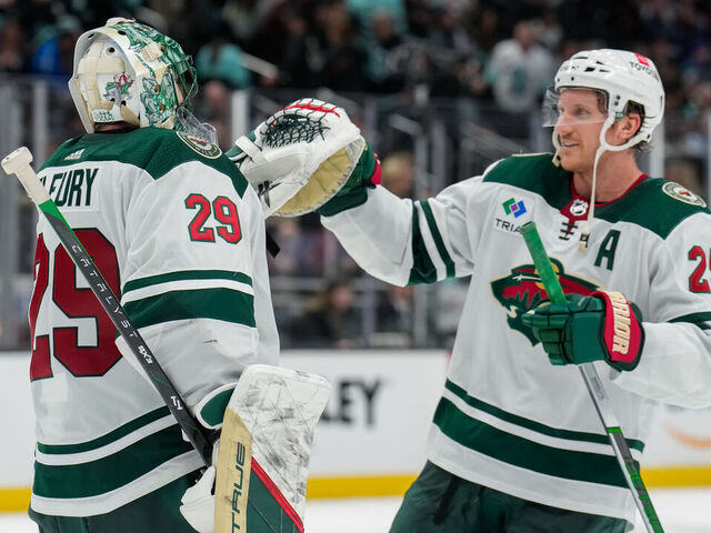 SEATTLE, WASHINGTON - FEBRUARY 24: Jonas Brodin #25 congratulates teammate Marc-Andre Fleury #29 of the Minnesota Wild after a game against the Seattle Kraken at Climate Pledge Arena on February 24, 2024 in Seattle, Washington.