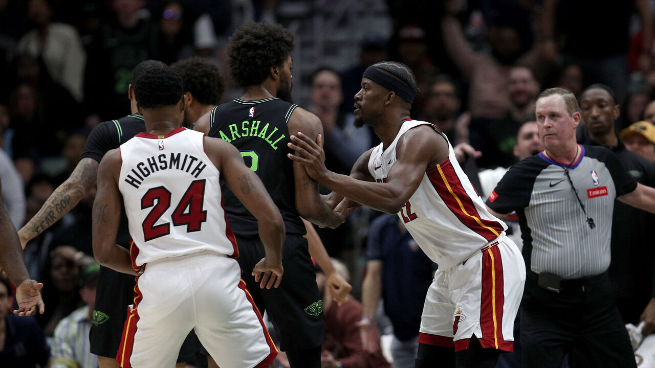 NEW ORLEANS, LOUISIANA - FEBRUARY 23: Naji Marshall #8 of the New Orleans Pelicans and Jimmy Butler #22 of the Miami Heat are involved in an altercation during the fourth quarter of an NBA game at Smoothie King Center on February 23, 2024 in New Orleans, Louisiana. Both players were ejected.