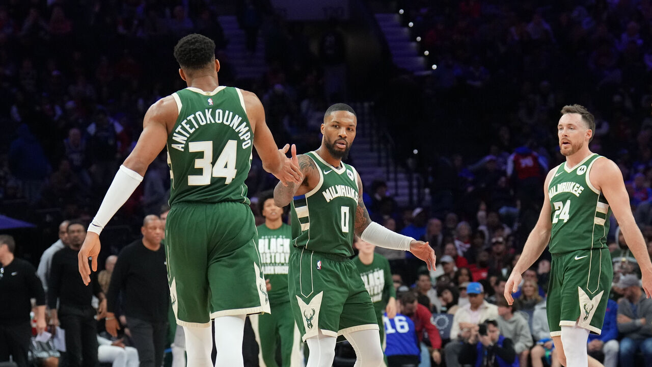 PHILADELPHIA, PA - FEBRUARY 25: Damian Lillard #0 high fives Giannis Antetokounmpo #34 of the Milwaukee Bucks during the game against the Philadelphia 76ers on February 25, 2024 at the Wells Fargo Center in Philadelphia, Pennsylvania NOTE TO USER: User expressly acknowledges and agrees that, by downloading and/or using this Photograph, user is consenting to the terms and conditions of the Getty Images License Agreement. Mandatory Copyright Notice: Copyright 2024 NBAE