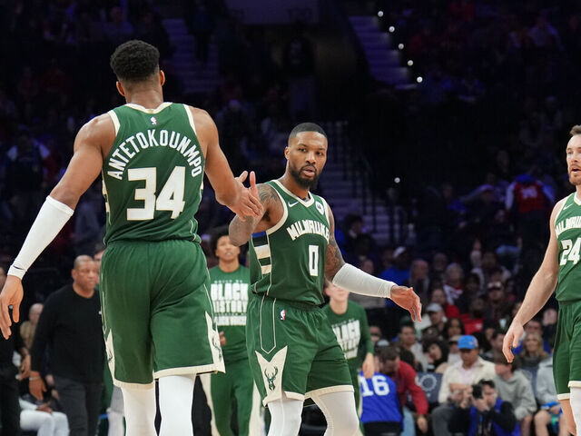 PHILADELPHIA, PA - FEBRUARY 25: Damian Lillard #0 high fives Giannis Antetokounmpo #34 of the Milwaukee Bucks during the game against the Philadelphia 76ers on February 25, 2024 at the Wells Fargo Center in Philadelphia, Pennsylvania NOTE TO USER: User expressly acknowledges and agrees that, by downloading and/or using this Photograph, user is consenting to the terms and conditions of the Getty Images License Agreement. Mandatory Copyright Notice: Copyright 2024 NBAE