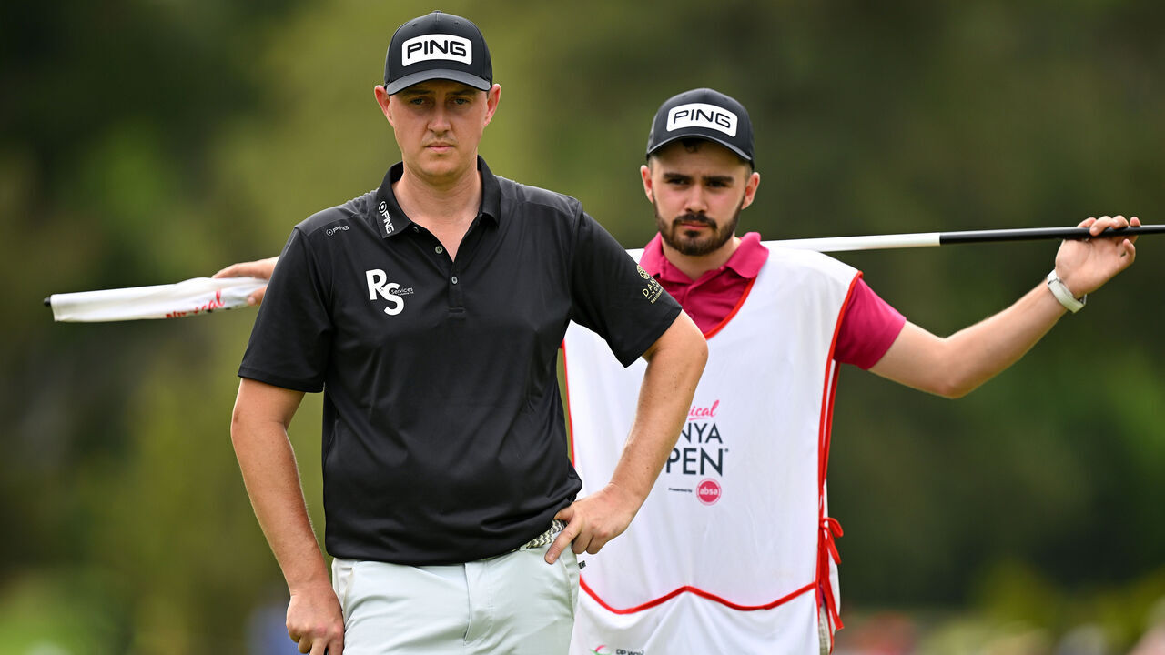 NAIROBI, KENYA - FEBRUARY 25: Joe Dean of England and his caddie line up a putt on the 16th green during day four of the Magical Kenya Open at Muthaiga Golf Club on February 25, 2024 in Nairobi, Kenya.