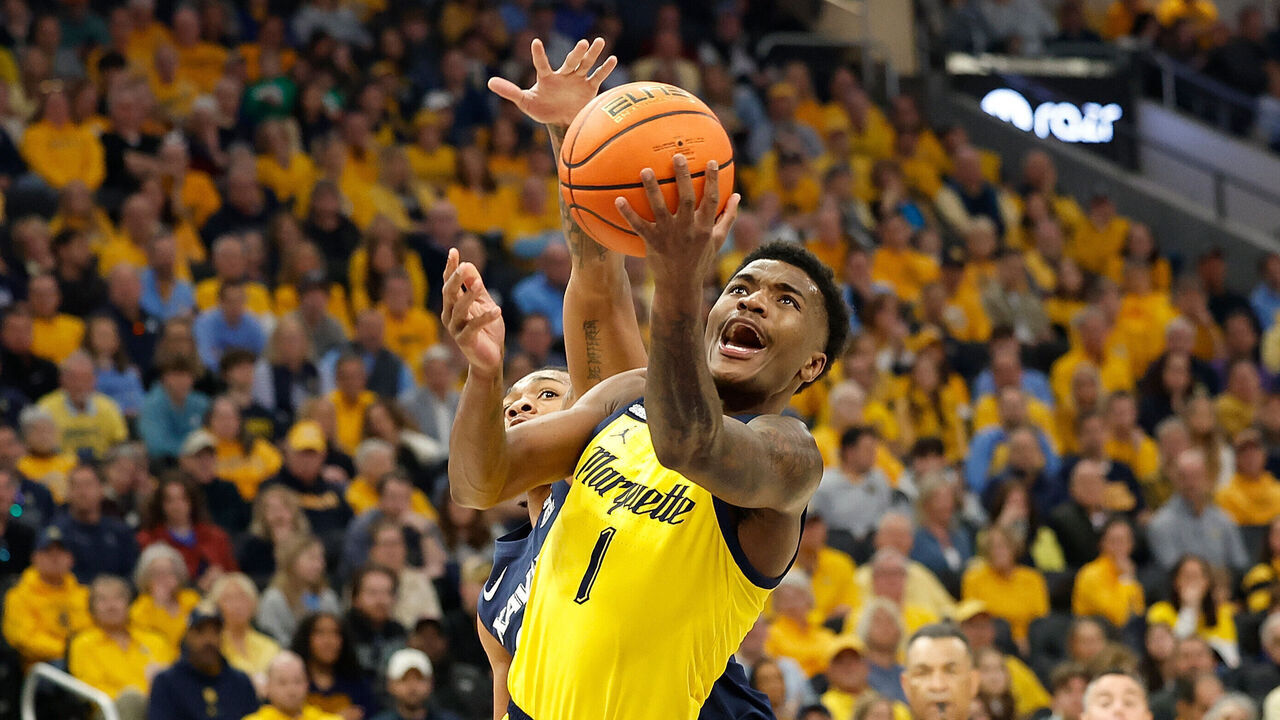 MILWAUKEE, WISCONSIN - FEBRUARY 25: Kam Jones #1 of the Marquette Golden Eagles is fouled going up for a shot in the first half against the Xavier Musketeers at Fiserv Forum on February 25, 2024 in Milwaukee, Wisconsin.