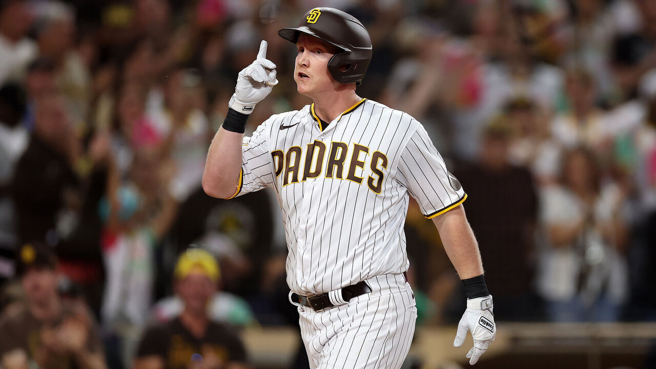SAN DIEGO, CALIFORNIA - SEPTEMBER 18: Garrett Cooper #24 of the San Diego Padres reacts after hitting a two run homerun during the second inning of a game against the Colorado Rockies at PETCO Park on September 18, 2023 in San Diego, California.