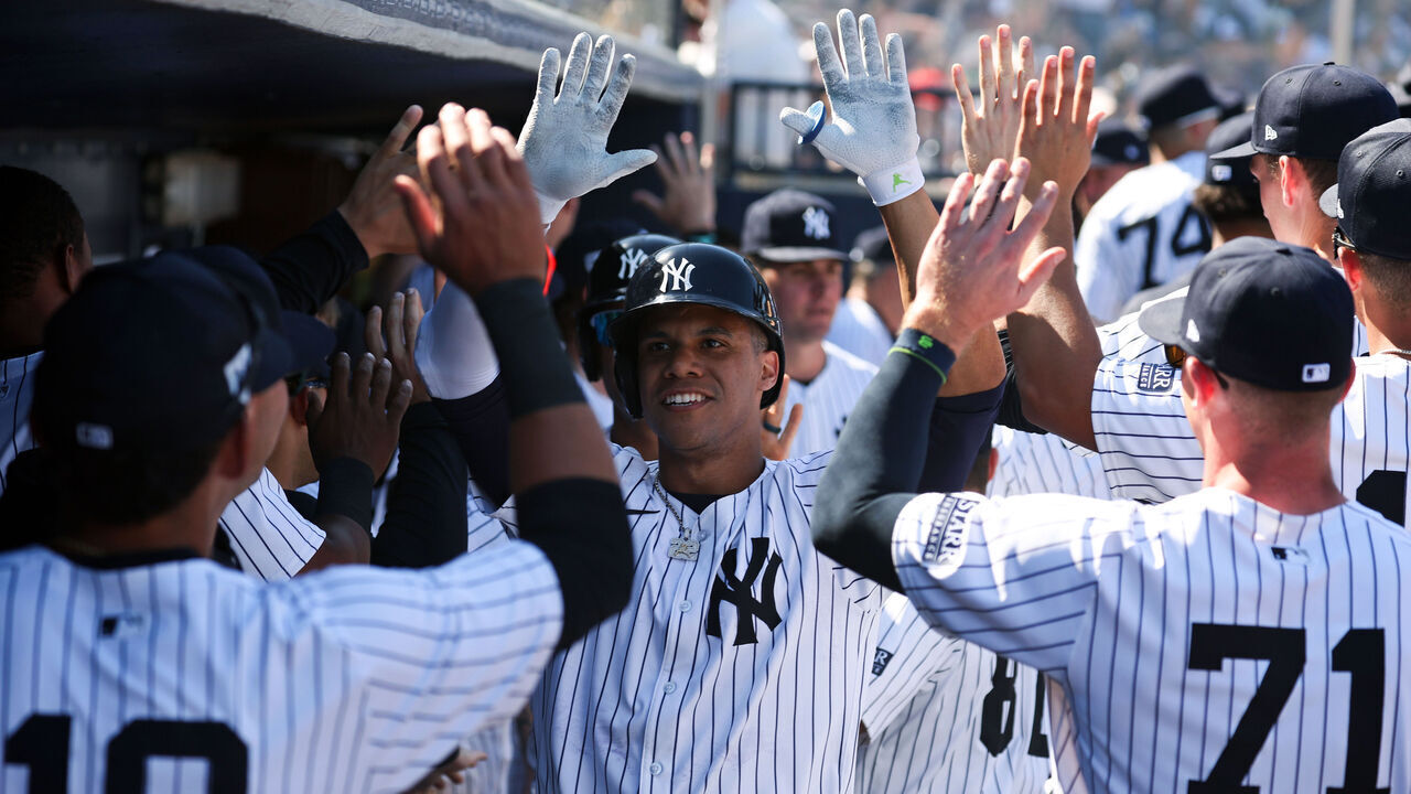 TAMPA, FL - FEBRUARY 25: Juan Soto #22 of the New York Yankees high fives teammates after hitting a home run during a spring training game against the Toronto Blue Jays at George M. Steinbrenner Field on February 25, 2024 in Tampa, Florida.