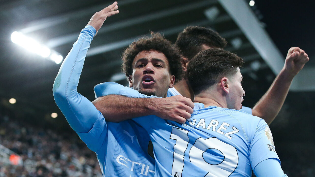 NEWCASTLE UPON TYNE, ENGLAND - JANUARY 13: Oscar Bobb of Manchester City celebrates his side's third goal with Julian Alvarez and Rodri during the Premier League match between Newcastle United and Manchester City at St. James Park on January 13, 2024 in Newcastle upon Tyne, England.