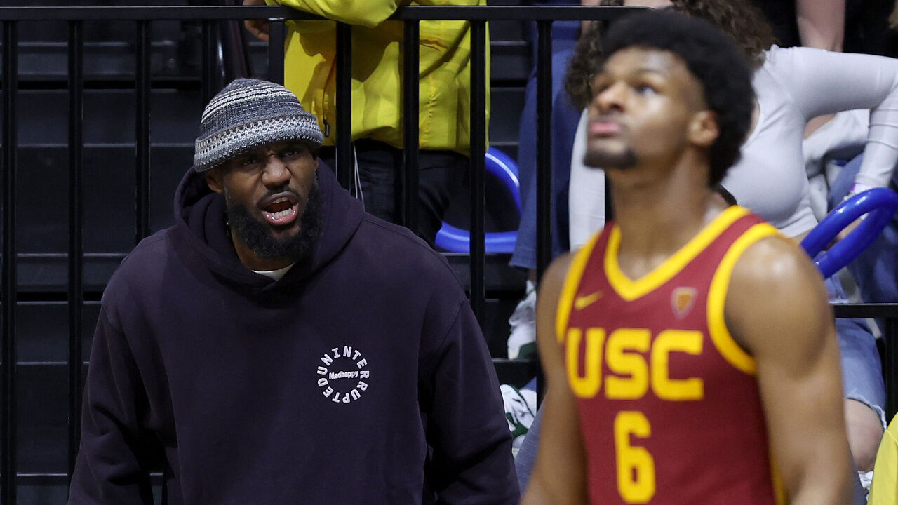 BERKELEY, CALIFORNIA - FEBRUARY 07: LeBron James #23 of the Los Angeles Lakers shouts to his son, Bronny James #6 of the USC Trojans, during Bronny's game against the California Golden Bears at Haas Pavilion on February 07, 2024 in Berkeley, California.