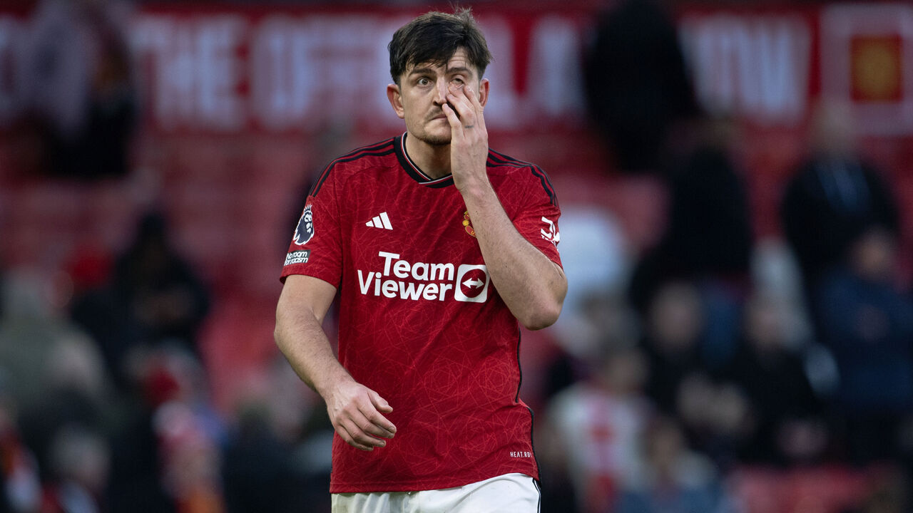 MANCHESTER, ENGLAND - FEBRUARY 24: A dejected Harry Maguire walks off after the Premier League match between Manchester United and Fulham FC at Old Trafford on February 24, 2024 in Manchester, England.