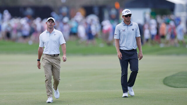 ORLANDO, FL - MARCH 05: Rory McIlroy of Northern Ireland and Talor Gooch of the United States walk up the fairway on the 1st hole during the third round of the Arnold Palmer Invitational presented by Mastercard at Arnold Palmer Bay Hill Golf Course on March 5, 2022 in Orlando, Florida.