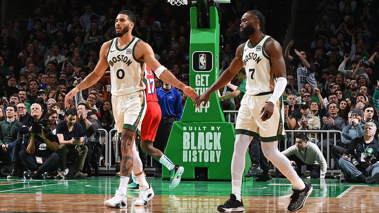 BOSTON, MA - FEBRUARY 27: Jayson Tatum #0 and Jaylen Brown #7 of the Boston Celtics high five during the game against the Philadelphia 76ers on February 27, 2024 at the TD Garden in Boston, Massachusetts. Mandatory Copyright Notice: Copyright 2024 NBAE