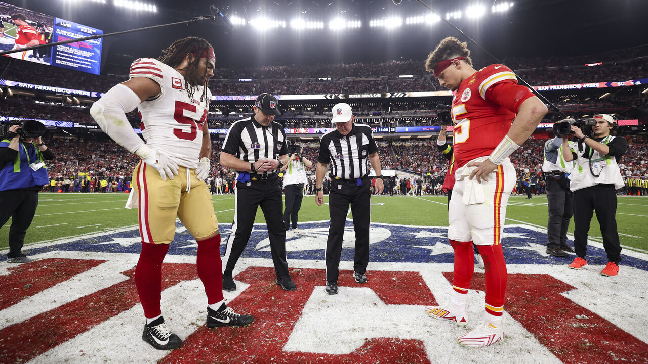 LAS VEGAS, NV - FEBRUARY 11: Fred Warner #54 of the San Francisco 49ers and Patrick Mahomes #15 of the Kansas City Chiefs look onto the coin toss before overtime of Super Bowl LVIII at Allegiant Stadium on February 11, 2024 in Las Vegas, NV.