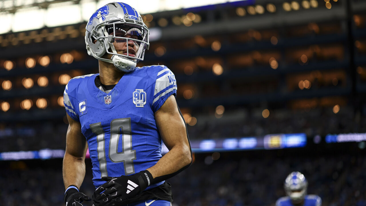DETROIT, MI - JANUARY 21: Amon-Ra St. Brown #14 of the Detroit Lions warms up prior to an NFL divisional round playoff football game against the Tampa Bay Buccaneers at Ford Field on January 21, 2024 in Detroit, Michigan.