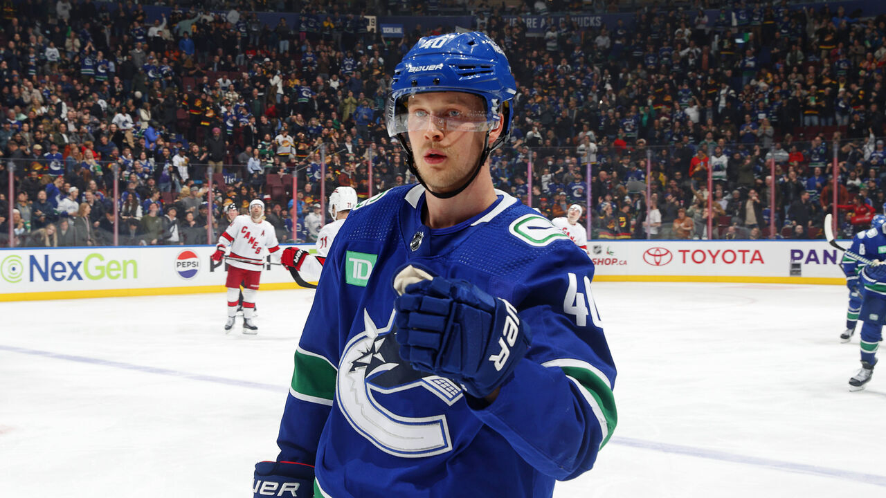 VANCOUVER, CANADA - DECEMBER 09: Elias Pettersson #40 of the Vancouver Canucks is congratulated by teammates after scoring during their NHL game against the Carolina Hurricanes at Rogers Arena on December 9, 2023 in Vancouver, British Columbia, Canada.