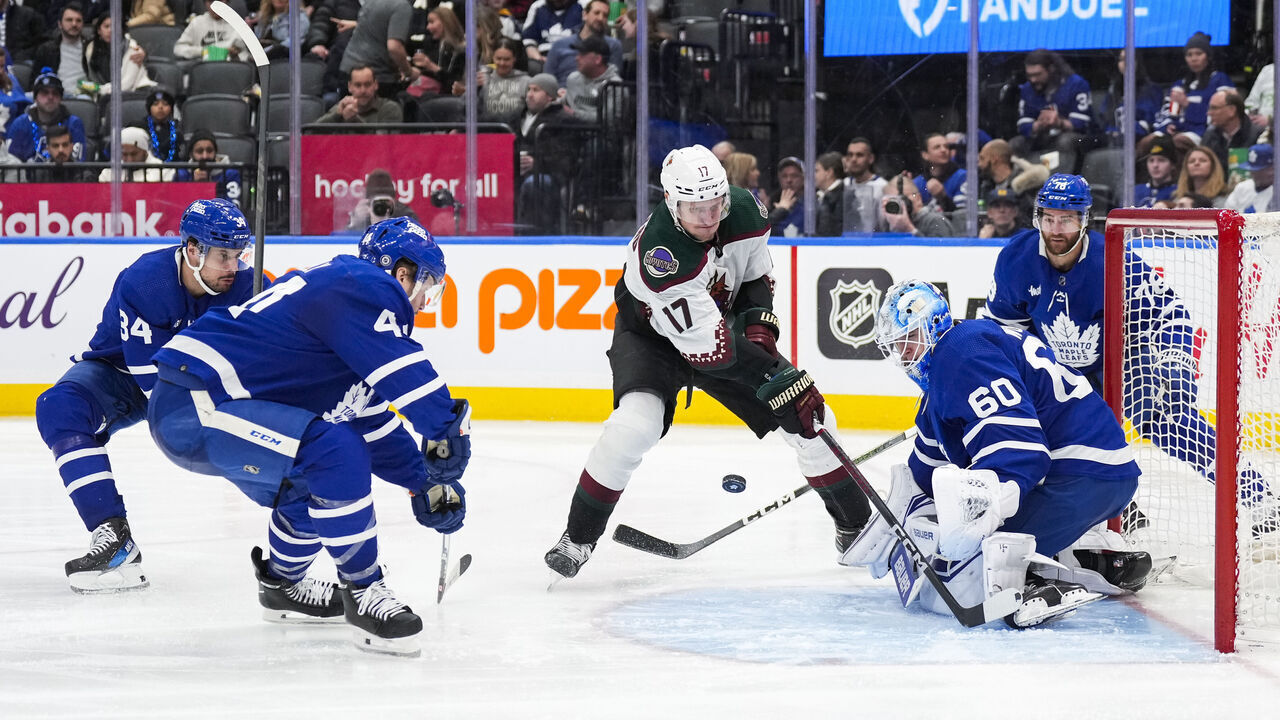 TORONTO, ON - FEBRUARY 29: Morgan Rielly #44 and Joseph Woll #60 of the Toronto Maple Leafs defend against Nick Bjugstad #17 of the Arizona Coyotes during the third period at Scotiabank Arena on February 29, 2024 in Toronto, Ontario, Canada.