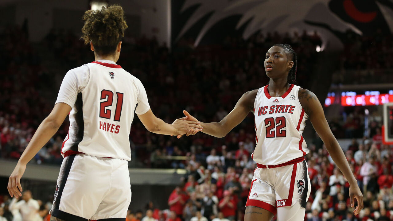 RALEIGH, NC - FEBRUARY 29: NC State Wolfpack guard Saniya Rivers (22) fives NC State Wolfpack guard Madison Hayes (21) during the college basketball game between the NC State Wolfpack and the Syracuse Orange on February 29, 2024 at Reynolds Coliseum in Raleigh, NC.