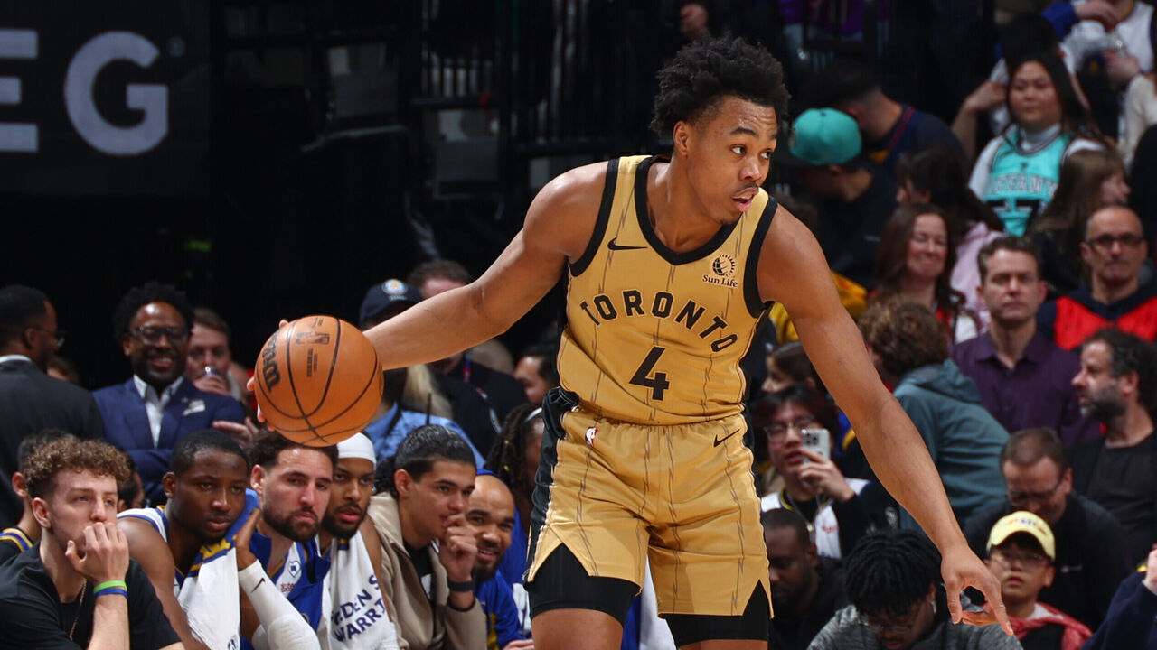 TORONTO, CANADA - MARCH 1: Trayce Jackson-Davis #32 of the Golden State Warriors plays defense during the game against Scottie Barnes #4 of the Toronto Raptors on March 1, 2024 at the Scotiabank Arena in Toronto, Ontario, Canada. Mandatory Copyright Notice: Copyright 2024 NBAE