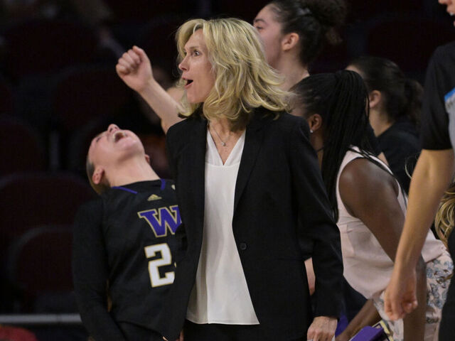 LOS ANGELES, CALIFORNIA - JANUARY 28: Head coach Tina Langley and the Washington Huskies bench celebrate after a basket in the second half against the USC Trojans at Galen Center on January 28, 2024 in Los Angeles, California.