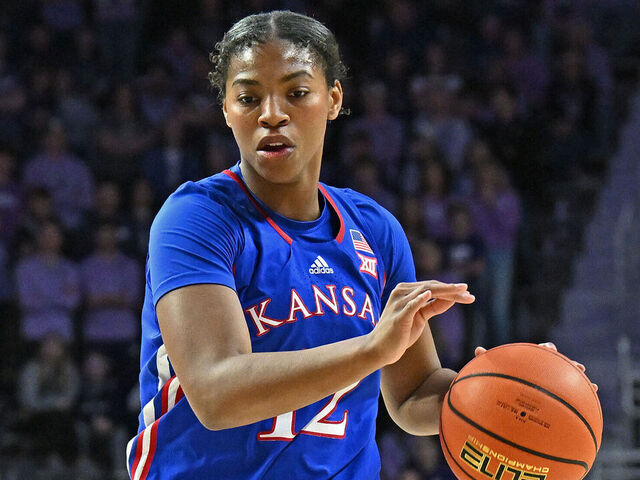 MANHATTAN, KS - JANUARY 20: S'Mya Nichols #12 of the Kansas Jayhawks dribbles the ball up court in the first half against the Kansas State Wildcats at Bramlage Coliseum on January 20, 2024 in Manhattan, Kansas.