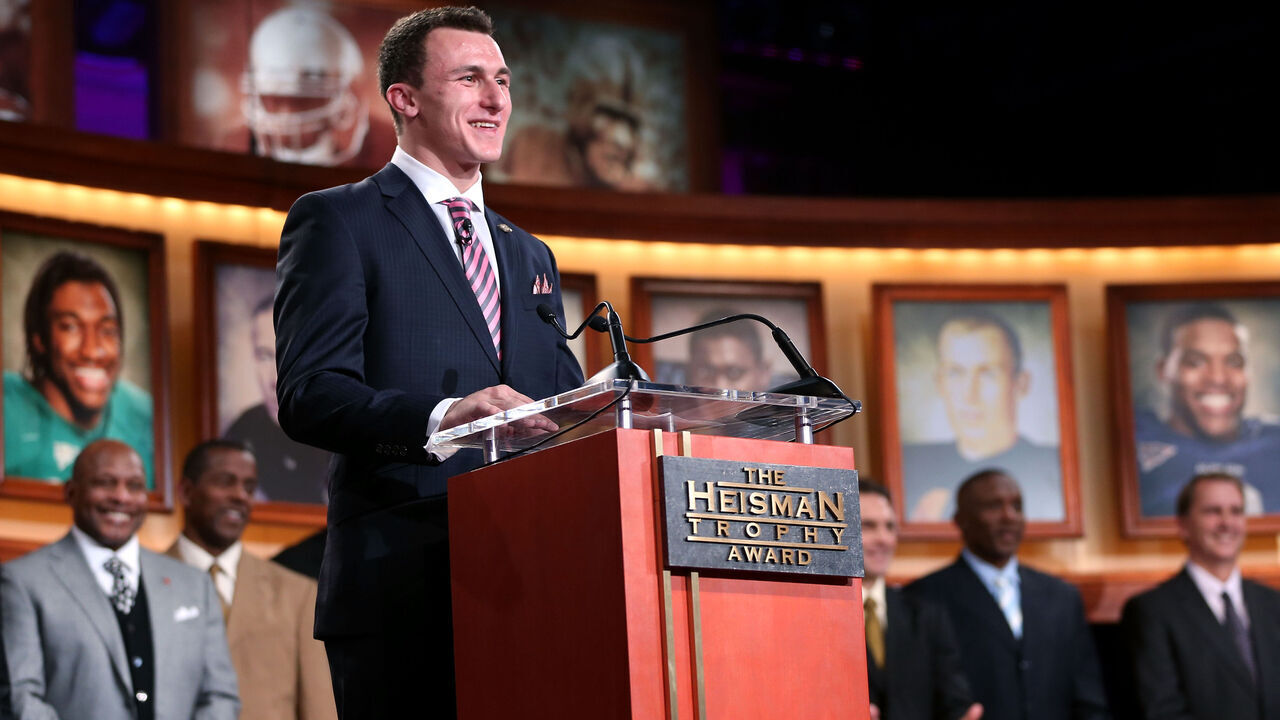 NEW YORK, NY - DECEMBER 08: Quarterback Johnny Manziel of the Texas A&M University Aggies poses with the Heisman Memorial Trophy after being named the 78th Heisman Memorial Trophy Award winner at the Best Buy Theater on December 8, 2012 in New York City. NOTE TO USER: Photos are for editorial usage only from December 8th to 22nd. No sales, no archive.