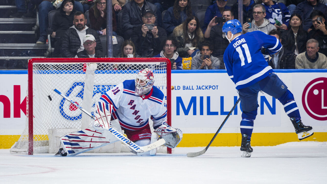 TORONTO, ON - MARCH 2: Max Domi #11 of the Toronto Maple Leafs scores against Igor Shesterkin #31 of the New York Rangers during a shootout at Scotiabank Arena on March 2, 2024 in Toronto, Ontario, Canada.