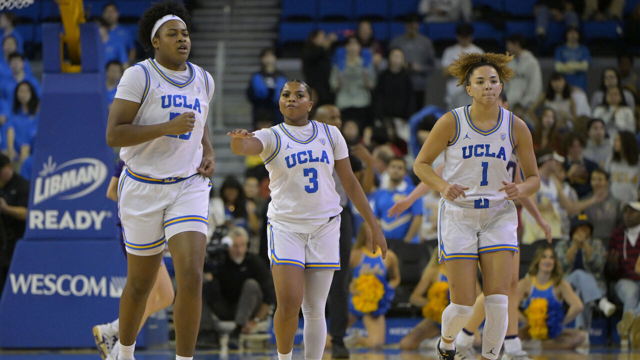 LOS ANGELES, CALIFORNIA - JANUARY 26: Christeen Iwuala #22, Londynn Jones #3 and Kiki Rice #1 the UCLA Bruins on the court against the Washington Huskies at UCLA Pauley Pavilion on January 26, 2024 in Los Angeles, California.