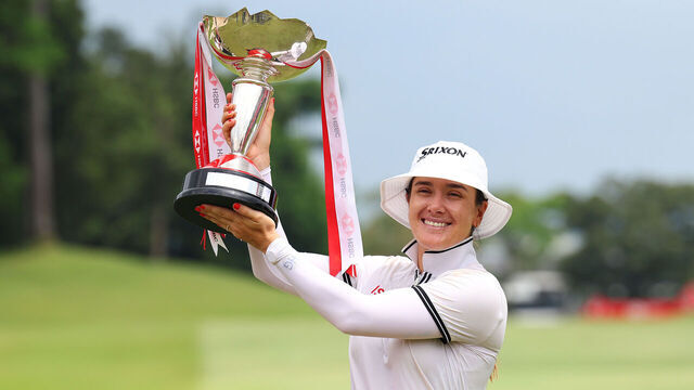 SINGAPORE, SINGAPORE - MARCH 03: Hannah Green of Australia poses with the trophy in celebration of victory on the 18th green on Day Four of the HSBC Women's World Championship at Sentosa Golf Club on March 03, 2024 in Singapore.