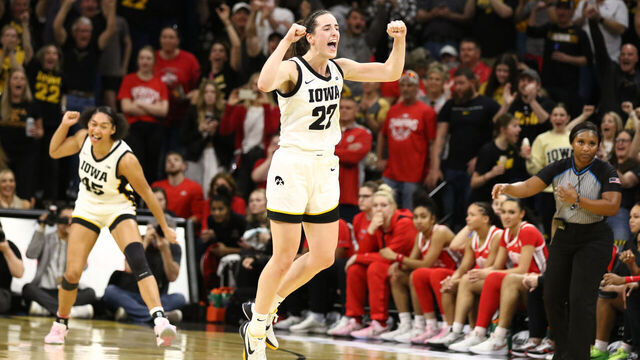 IOWA CITY, IOWA- MARCH 3: Guard Caitlin Clark #22 of the Iowa Hawkeyes celebrates after breaking Pete Maravich's all-time NCAA scoring record during the first half against the Ohio State Buckeyes at Carver-Hawkeye Arena on March 3, 2024 in Iowa City, Iowa.