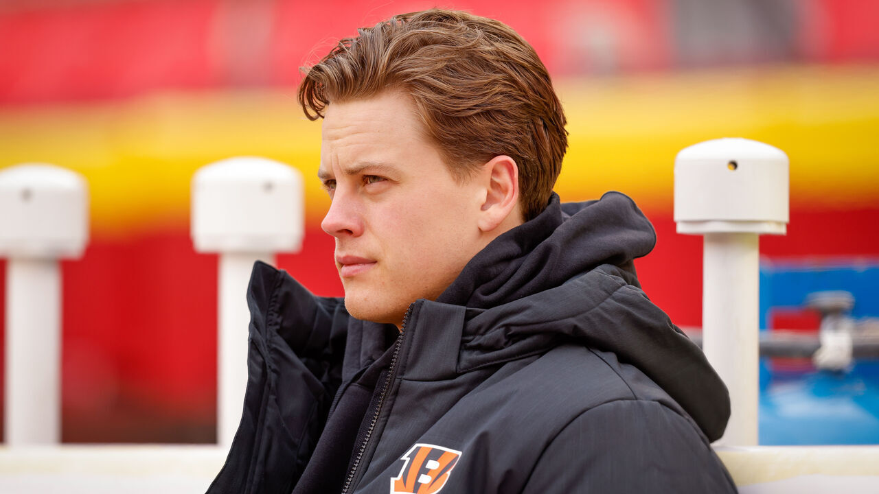 KANSAS CITY, MISSOURI - DECEMBER 31: Joe Burrow #9 of the Cincinnati Bengals sits on the team bench prior to the game against the Kansas City Chiefs at GEHA Field at Arrowhead Stadium on December 31, 2023 in Kansas City, Missouri.