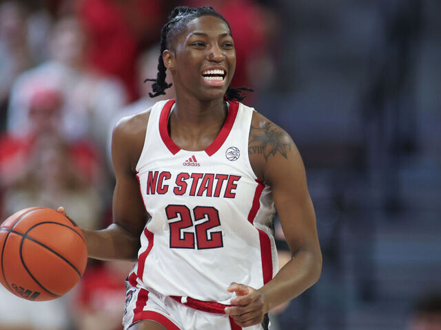 RALEIGH, NC - MARCH 03: NC State Wolfpack guard Saniya Rivers (22) brings the ball up court during the college basketball game between the NC State Wolfpack and the Wake Forest Demon Deacons on March 3, 2024 at Reynolds Coliseum in Raleigh, NC.
