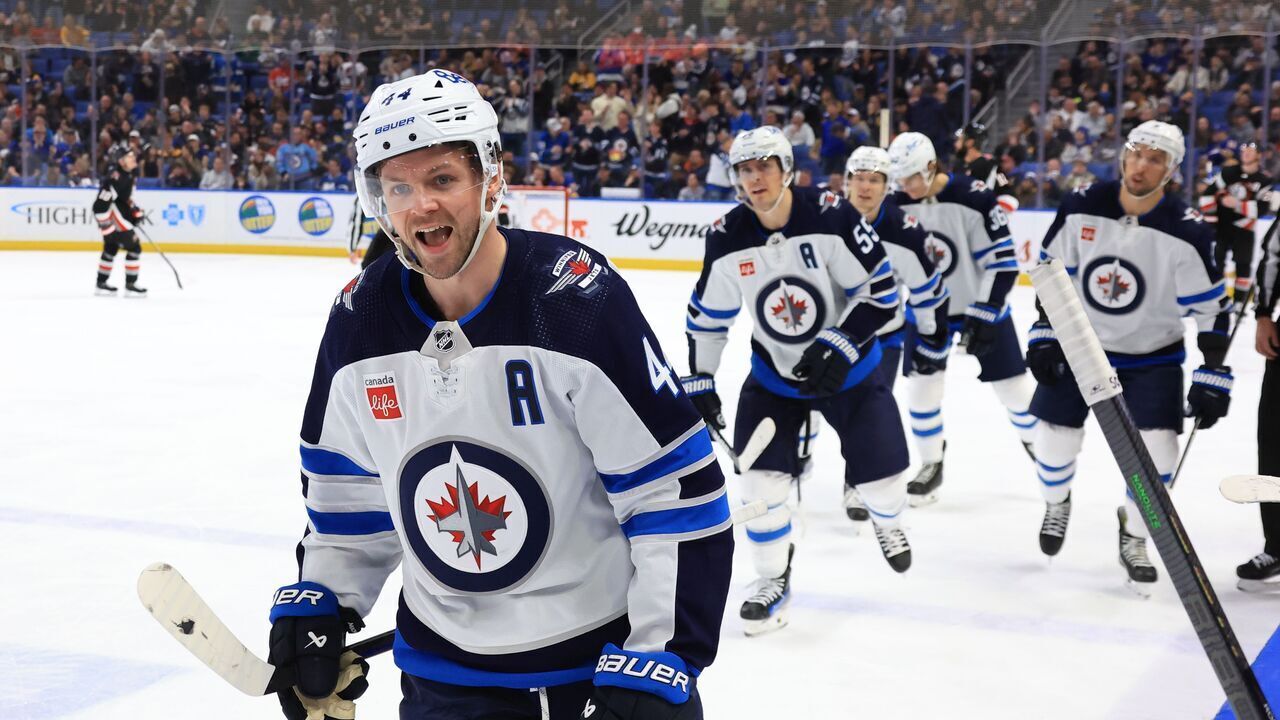 BUFFALO, NEW YORK - MARCH 3: Josh Morrissey #44 of the Winnipeg Jets heads to the bench to celebrate his third period goal against the Buffalo Sabres during an NHL game on March 3, 2024 at KeyBank Center in Buffalo, New York.