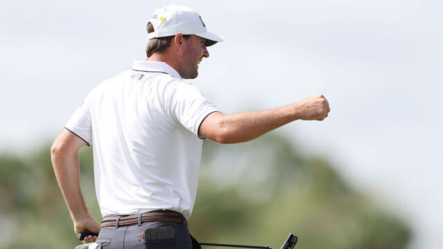 PALM BEACH GARDENS, FLORIDA - MARCH 04: Austin Eckroat of the United States celebrates on the 18th green on his way to winning during the continuation of the weather delayed final round of The Cognizant Classic in The Palm Beaches at PGA National Resort And Spa on March 04, 2024 in Palm Beach Gardens, Florida.
