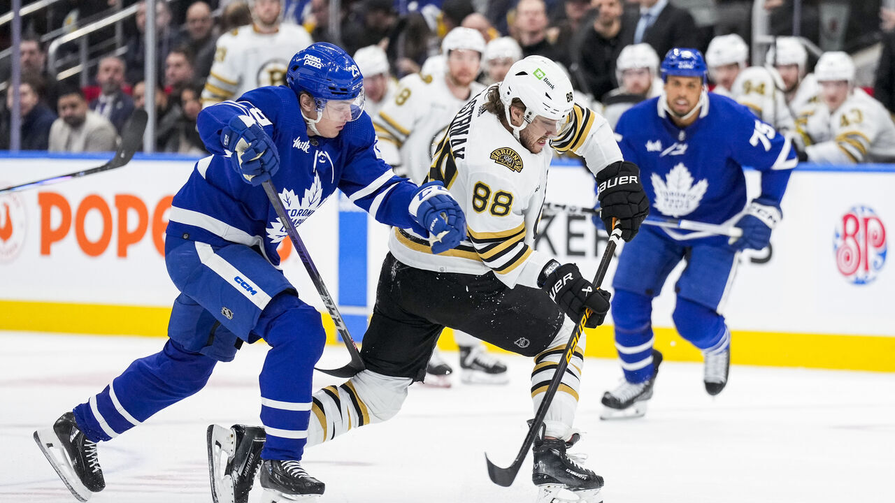 TORONTO, ON - MARCH 4: David Pastrnak #88 of the Boston Bruins plays the puck against Pontus Holmberg #29 of the Toronto Maple Leafs during the first period at Scotiabank Arena on March 4, 2024 in Toronto, Ontario, Canada.