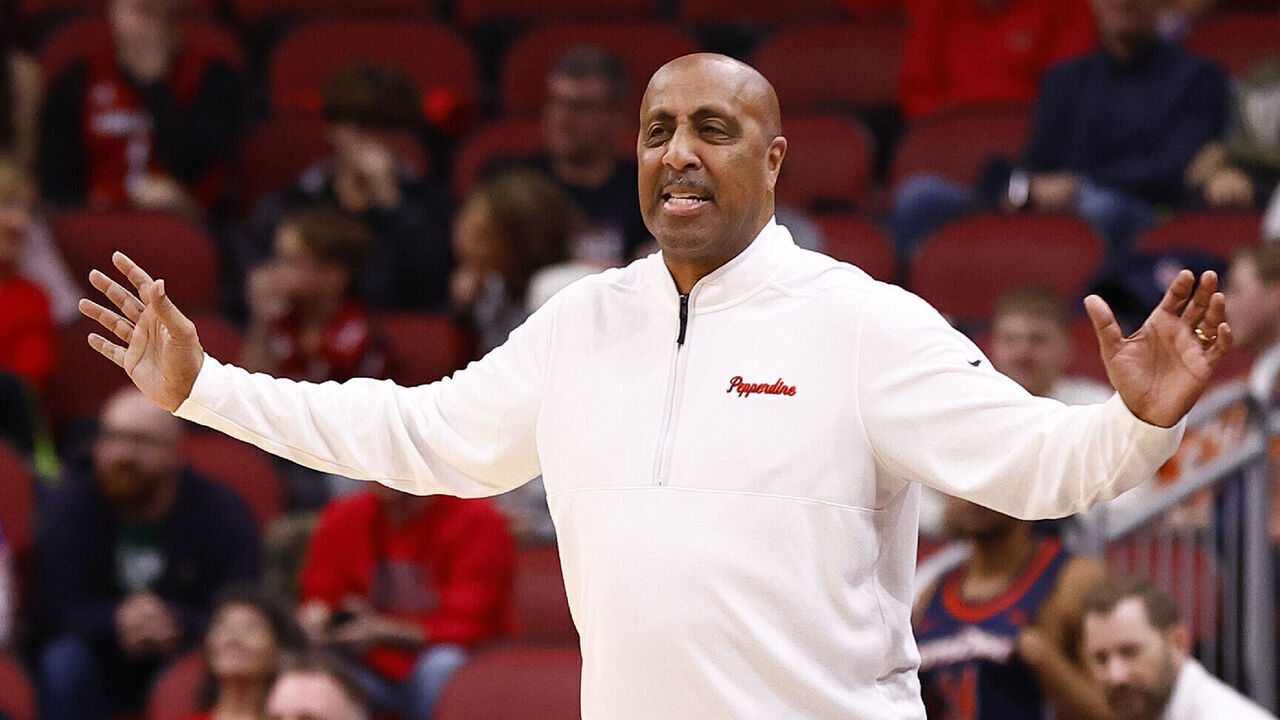 LOUISVILLE, KY - DECEMBER 17: Pepperdine Waves head coach Lorenzo Romar talks to his team during a mens college basketball game between the Pepperdine Waves and the Louisville Cardinals on December 17, 2023 at KFC Yum! Center in Louisville, KY.