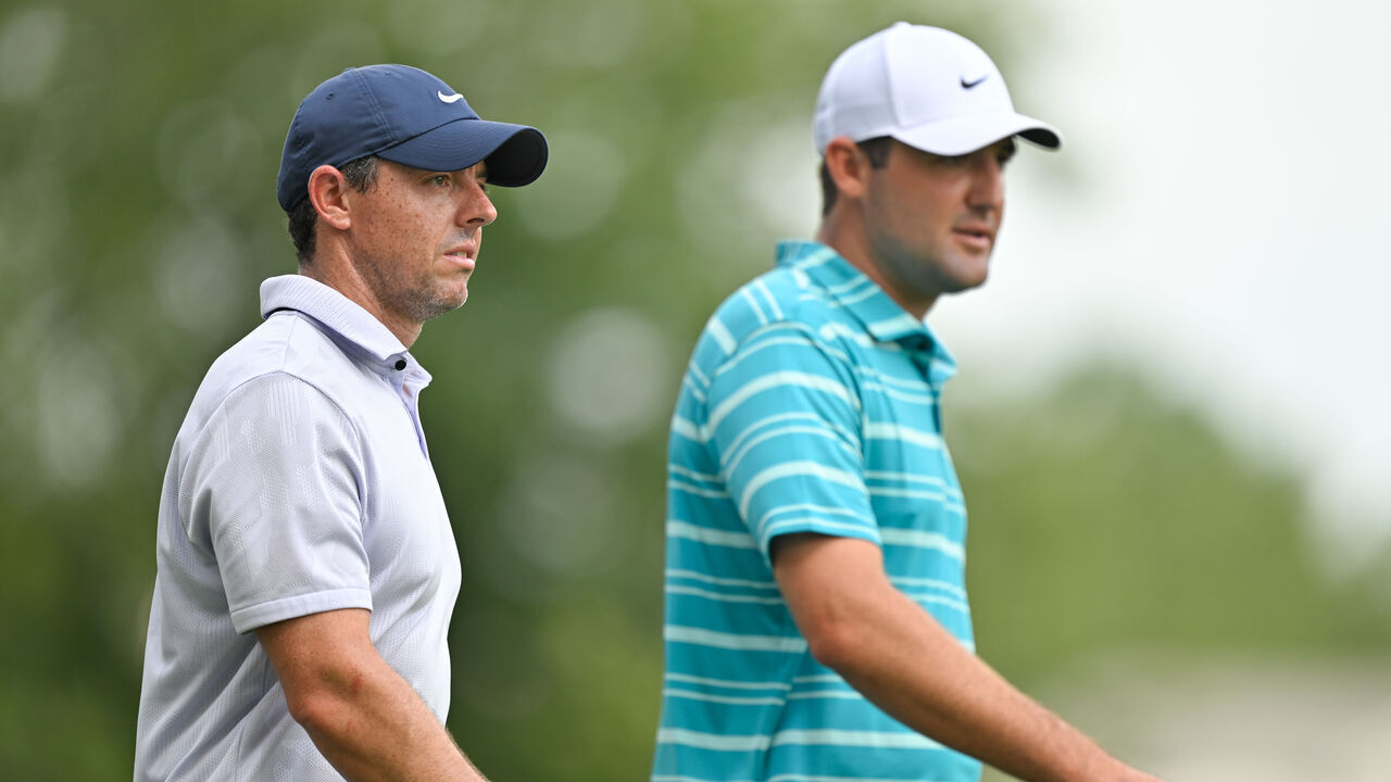 MEMPHIS, TENNESSEE - AUGUST 11: Rory McIlroy of Northern Ireland and Scottie Scheffler walk off the 11th tee box together during the second round of the FedEx St. Jude Championship at TPC Southwind on August 11, 2023 in Memphis, Tennessee.