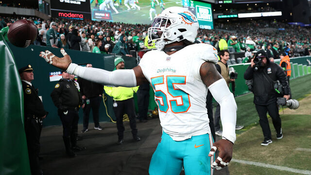 PHILADELPHIA, PENNSYLVANIA - OCTOBER 22: Jerome Baker #55 of the Miami Dolphins tosses the ball to fans after scoring a touchdown on an interception against the Philadelphia Eagles during the second half of a game at Lincoln Financial Field on October 22, 2023 in Philadelphia, Pennsylvania.