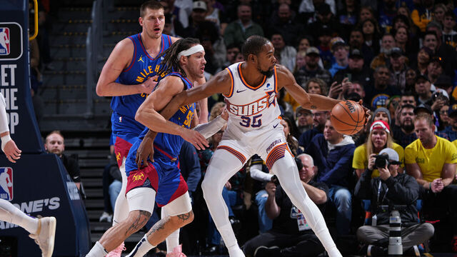 DENVER, CO - MARCH 5: Kevin Durant #35 of the Phoenix Suns dribbles the ball during the game against the Denver Nuggets on March 5, 2024 at the Ball Arena in Denver, Colorado. NOTE TO USER: User expressly acknowledges and agrees that, by downloading and/or using this Photograph, user is consenting to the terms and conditions of the Getty Images License Agreement. Mandatory Copyright Notice: Copyright 2024 NBAE