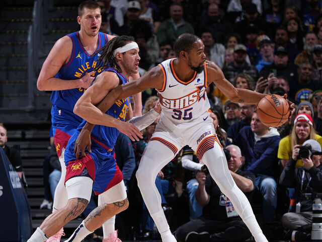 DENVER, CO - MARCH 5: Kevin Durant #35 of the Phoenix Suns dribbles the ball during the game against the Denver Nuggets on March 5, 2024 at the Ball Arena in Denver, Colorado. NOTE TO USER: User expressly acknowledges and agrees that, by downloading and/or using this Photograph, user is consenting to the terms and conditions of the Getty Images License Agreement. Mandatory Copyright Notice: Copyright 2024 NBAE