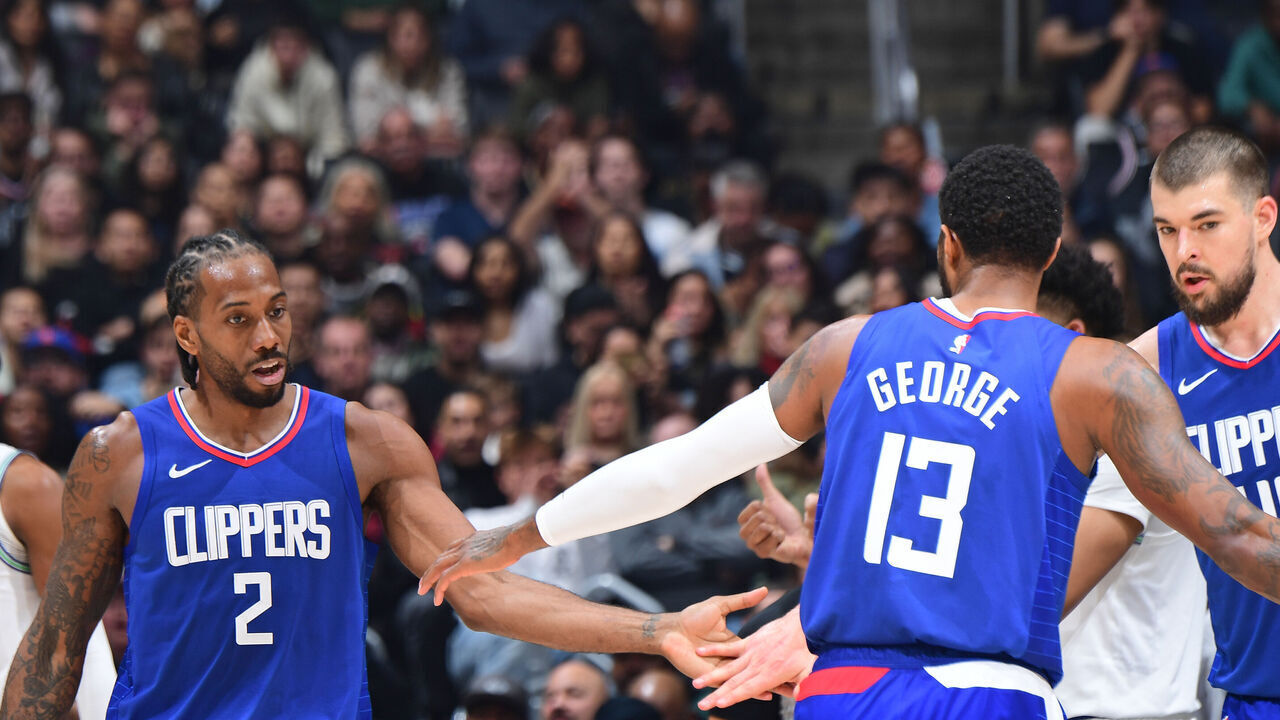 LOS ANGELES, CA - FEBRUARY 12: Kawhi Leonard #2 and Paul George #13 of the LA Clippers high five during the game against the Minnesota Timberwolves on February 12, 2024 at Crypto.Com Arena in Los Angeles, California. NOTE TO USER: User expressly acknowledges and agrees that, by downloading and/or using this Photograph, user is consenting to the terms and conditions of the Getty Images License Agreement. Mandatory Copyright Notice: Copyright 2024 NBAE