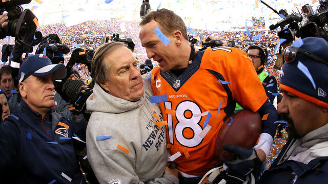 DENVER, CO - JANUARY 24: Peyton Manning #18 of the Denver Broncos and head coach Bill Belichick of the New England Patriots speak after the AFC Championship game at Sports Authority Field at Mile High on January 24, 2016 in Denver, Colorado. The Broncos defeated the Patriots 20-18.
