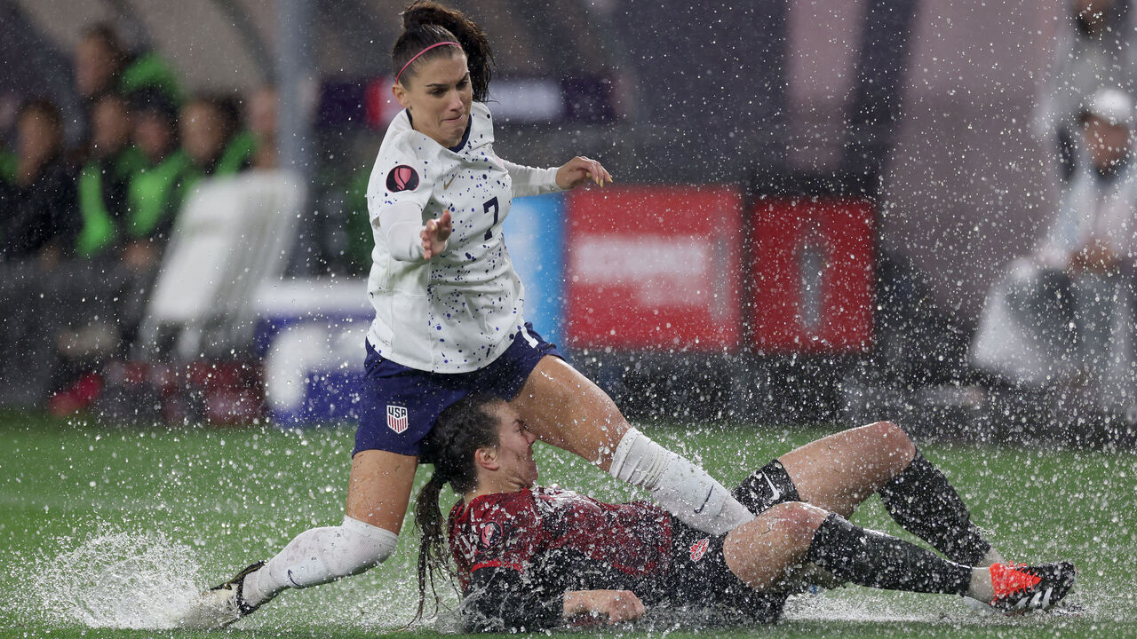 SAN DIEGO, CALIFORNIA - MARCH 06: Alex Morgan #7 of the United States and Vanessa Gilles #14 of Canada collide in the first half during the 2024 Concacaf W Gold Cup semifinals at Snapdragon Stadium on March 06, 2024 in San Diego, California.