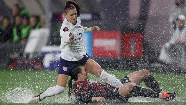SAN DIEGO, CALIFORNIA - MARCH 06: Alex Morgan #7 of the United States and Vanessa Gilles #14 of Canada collide in the first half during the 2024 Concacaf W Gold Cup semifinals at Snapdragon Stadium on March 06, 2024 in San Diego, California.